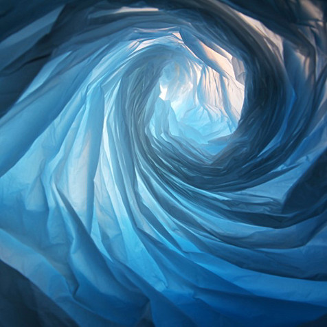 A blue vortex shape with a light at the end