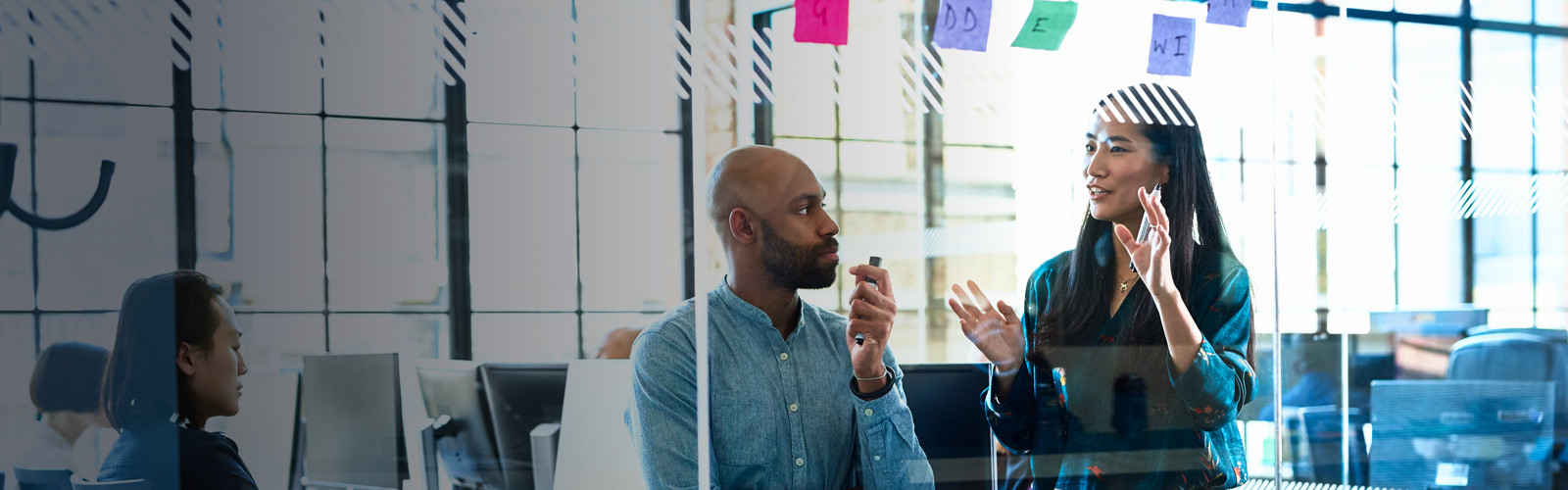 two colleagues discussing something