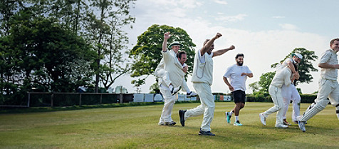 cricket players on field