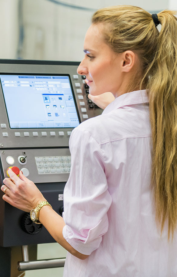 Woman manipulating a machine