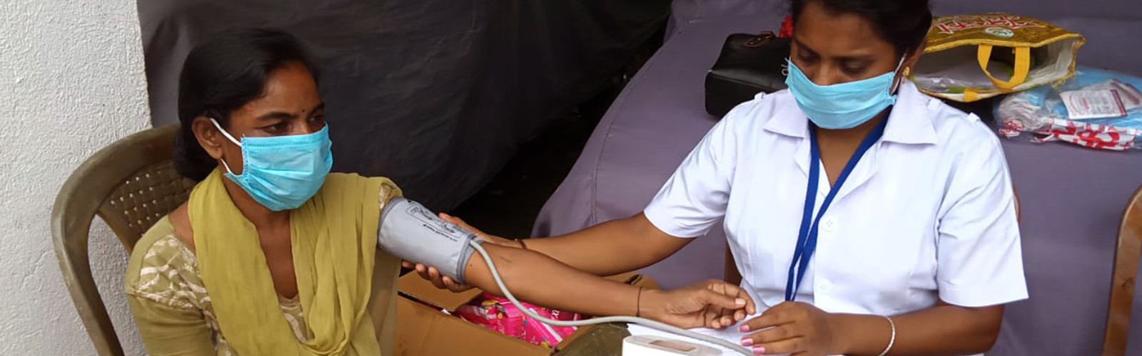 Doctor is checking a blood pressure to a girl