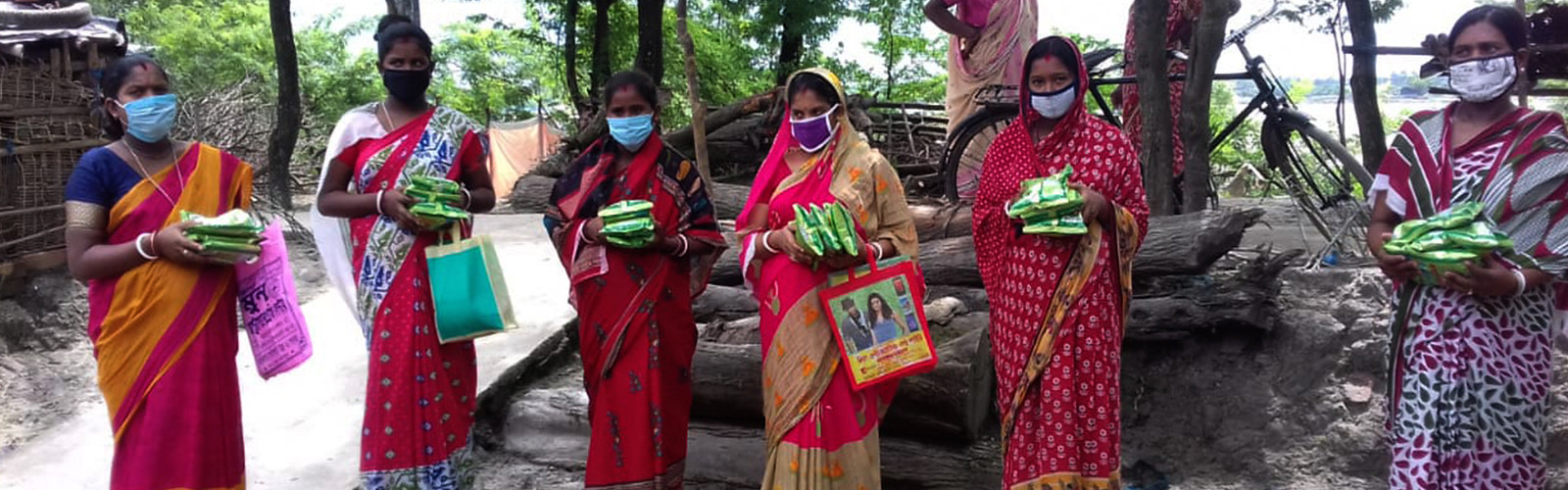 women's are holding groceries in their hands