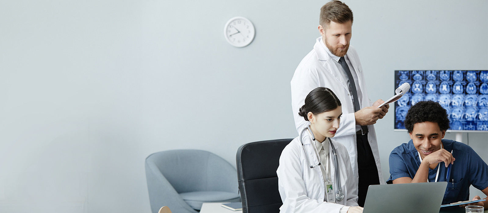 doctors looking at a laptop