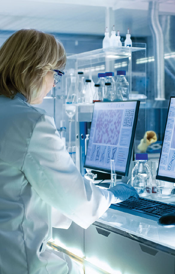 Woman in laboratory on work computer