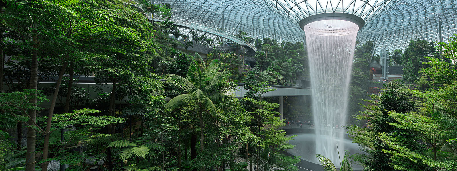  Jewel Changi Airport is a new terminal building under a glass dome, with indoor waterfall and tropical forest, shopping malls and dining, in Singapore,  Jewel Changi Airport is a new terminal building under a glass d