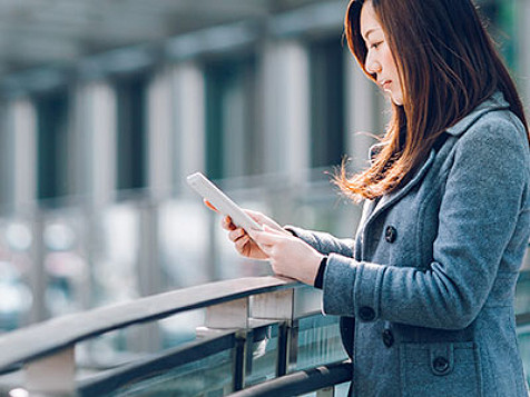 woman checking tablet