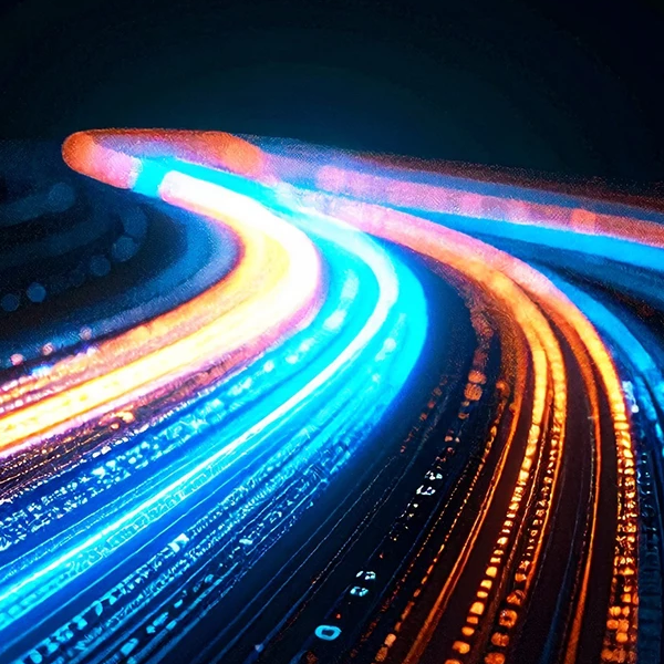 Abstract image of streaks of digital lights forming a curving road like shape against a black background