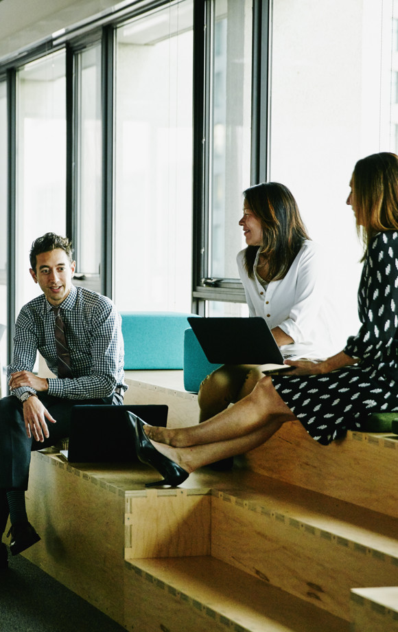 Three people in a meeting