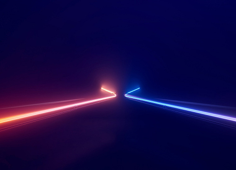 Two litup lines on either dide of a lane converging at the end