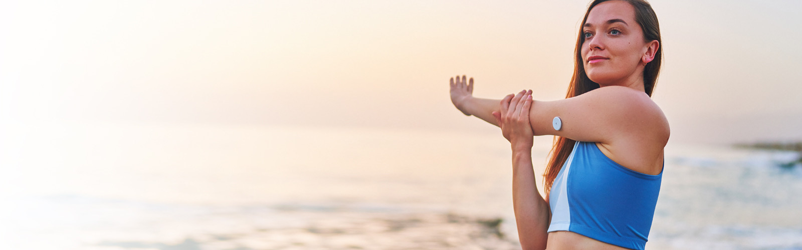 Woman stretching on the beach