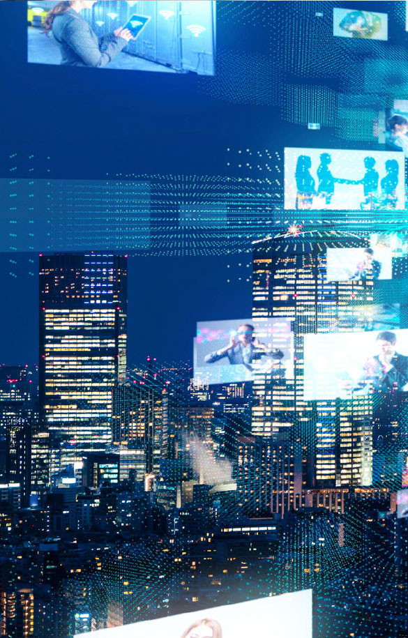 Billboard screen over city skylines at night