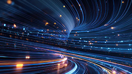 Swirling blue and orange light trails create a dynamic, futuristic scene. The motion conveys speed and energy against a dark background.