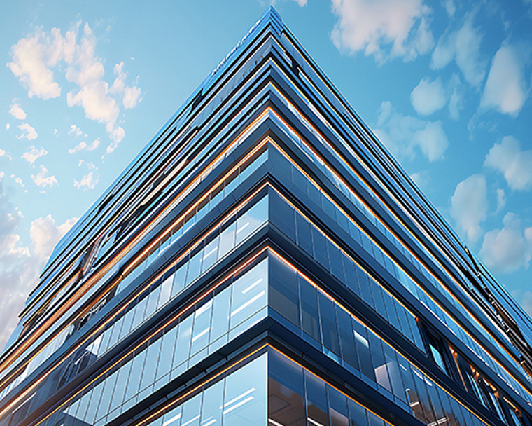 Low-angle view of a modern glass office building