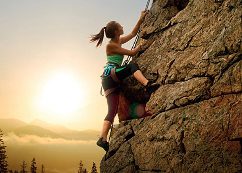 A female climbing a mountain 