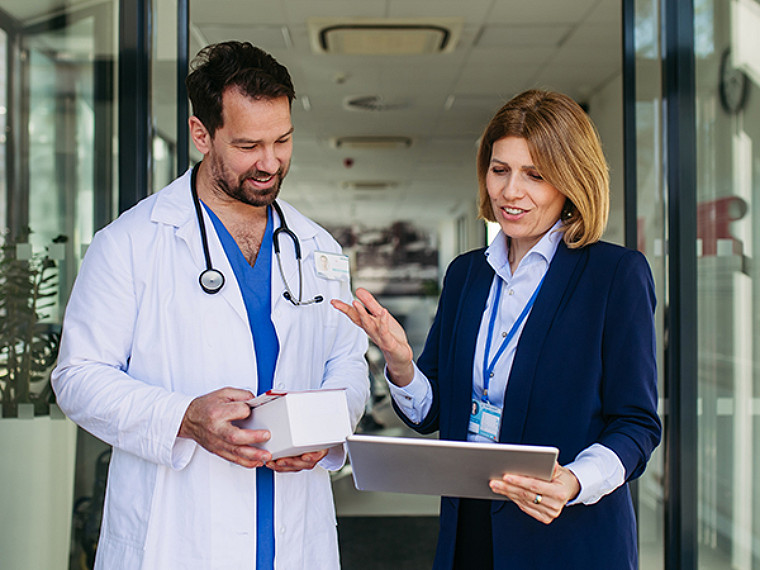 A female doctor giving a medical presentation in a meeting room