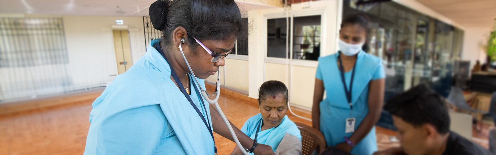 Nurse checking blood pressure