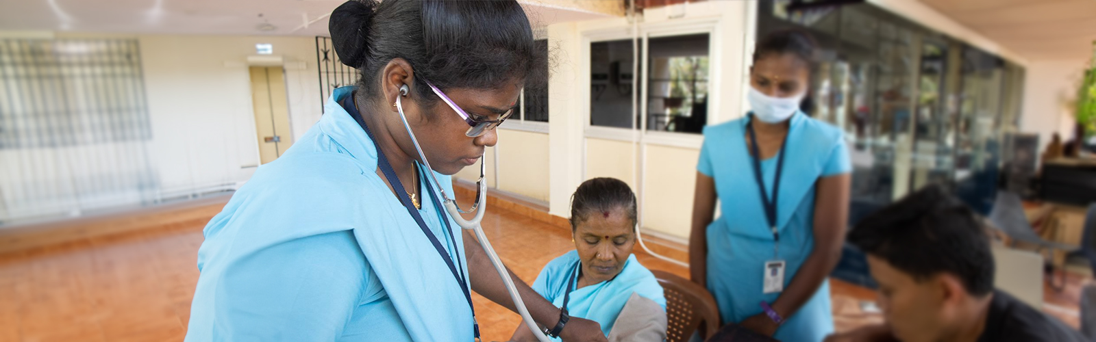 doctor checking a patient using a stethoscope