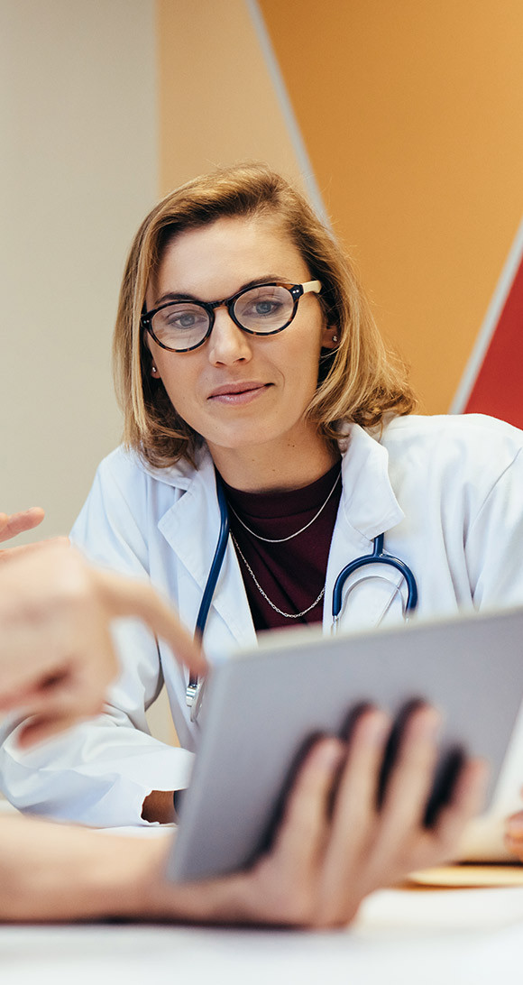 Doctor reading on  a tablet