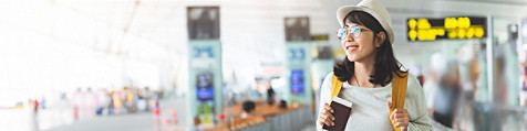 Photo of a traveller holding a passport