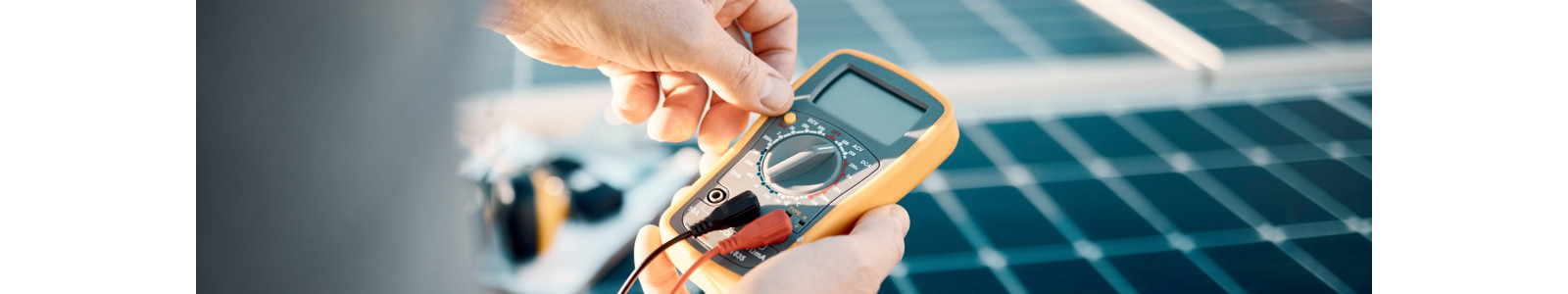 Hands holding a multimeter