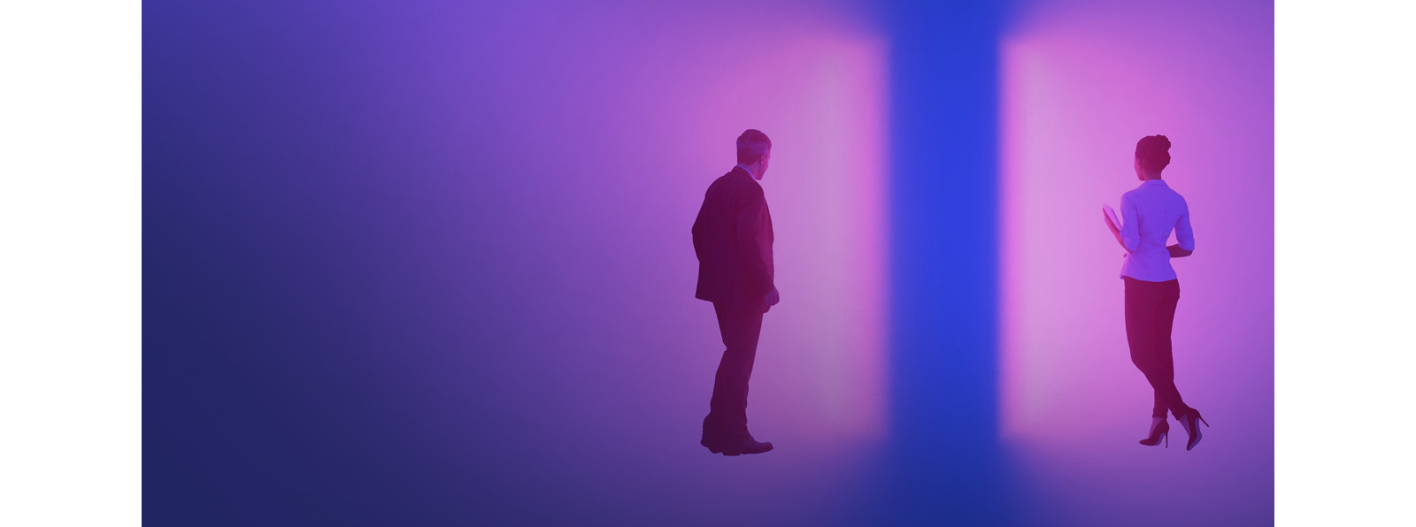 man and woman facing a blue and pink gradient wall