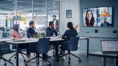 men and woman looking at a screen