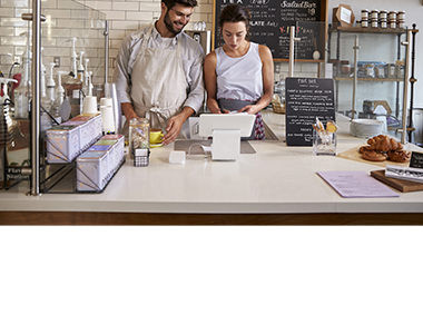 Two restaurant worker at bill counter