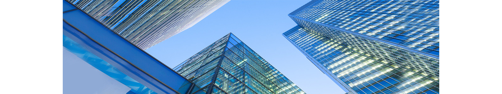 Looking up around with tall glass buildings