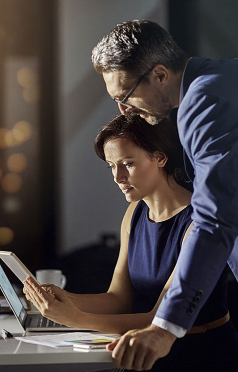 Business associates discussing work over tablet