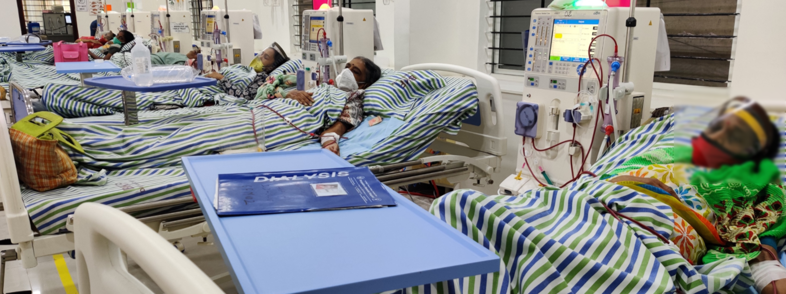 patients sleeping on their beds getting medical treatment