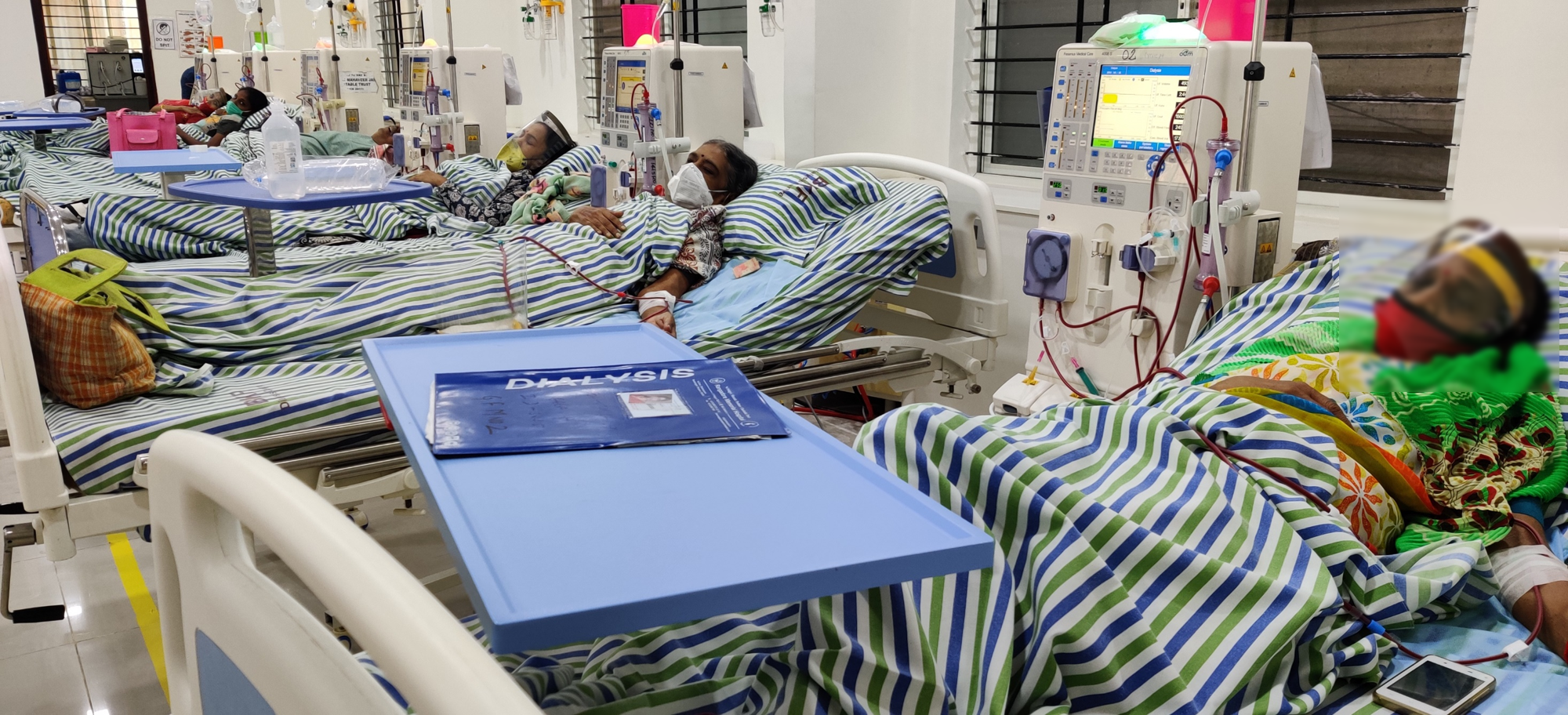 patients sleeping on their beds getting medical treatment