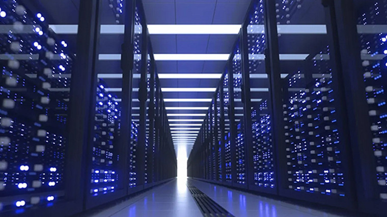 Rows of illuminated server racks inside a modern data center