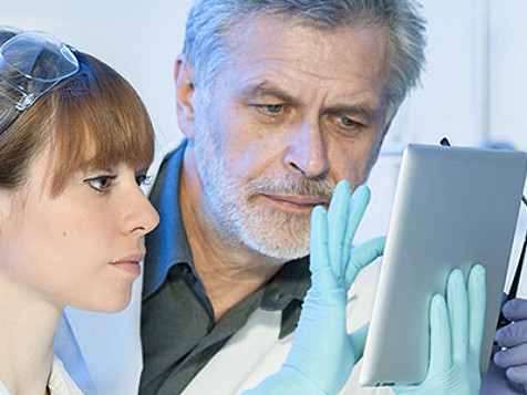 scientists viewing a report