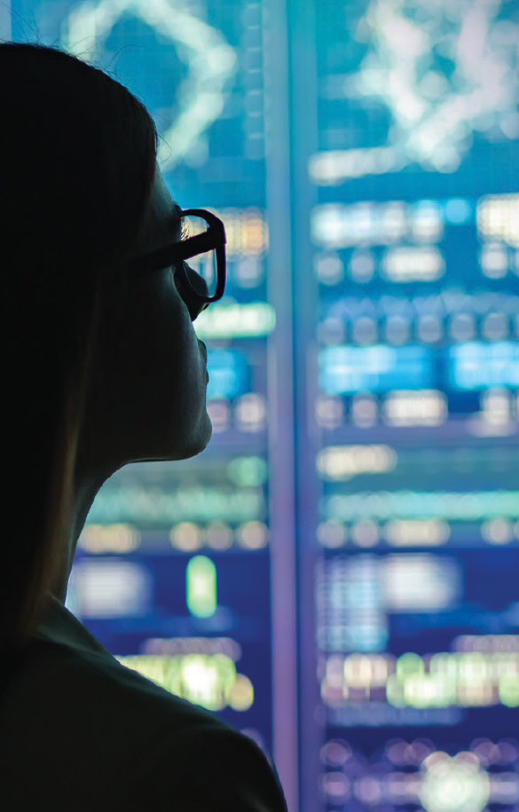 Female in glasses looking at datacenter