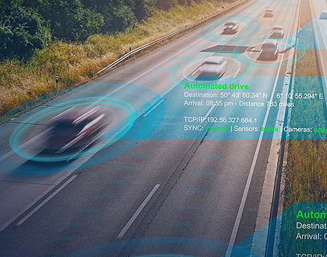 Fast moving cars on a road with an overlay of tracking details 