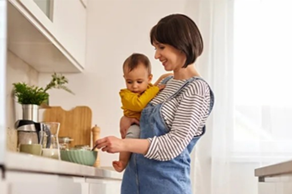 A women in home taking care her baby