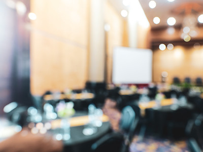 hazy photo of a conference hall
