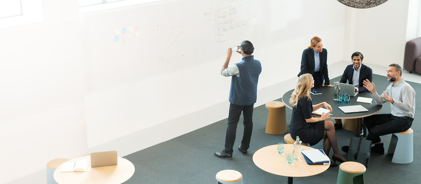 People listening to someone in a meeting
