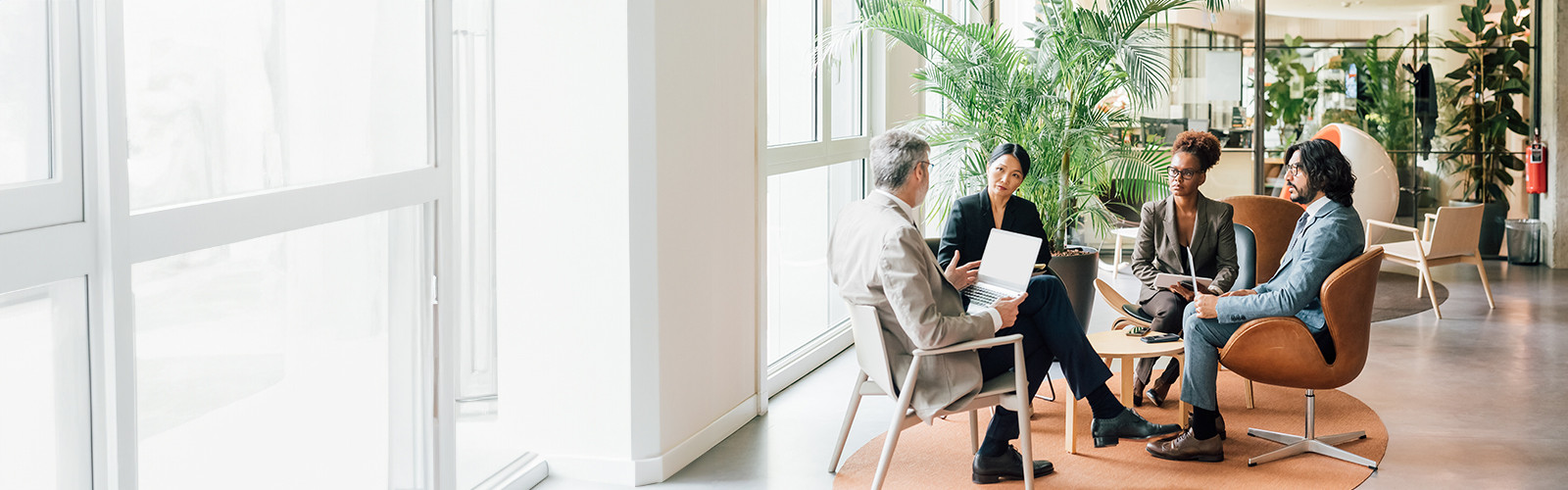 People listening to someone in a meeting