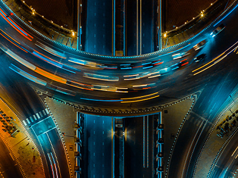 Top view of a highway overpass during night time.