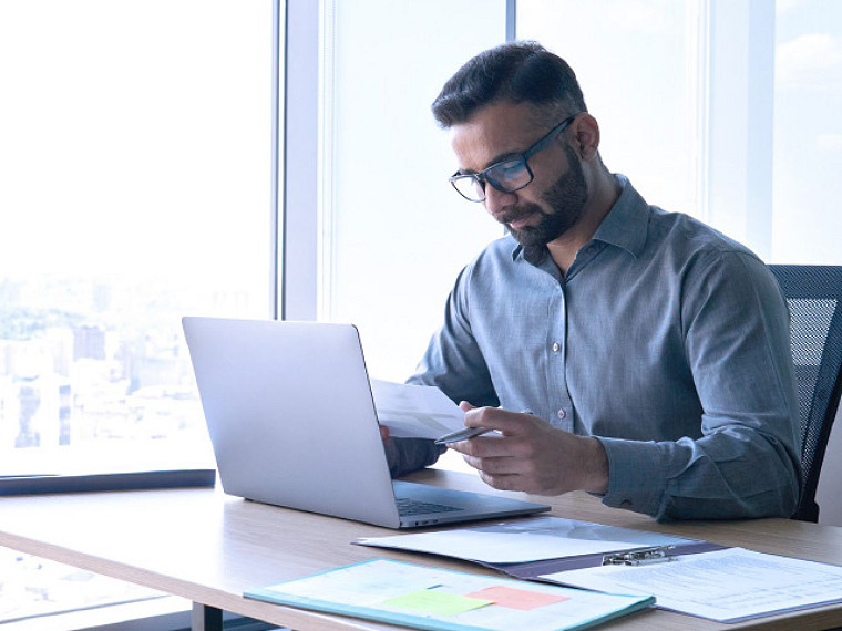 Associate looking at laptop