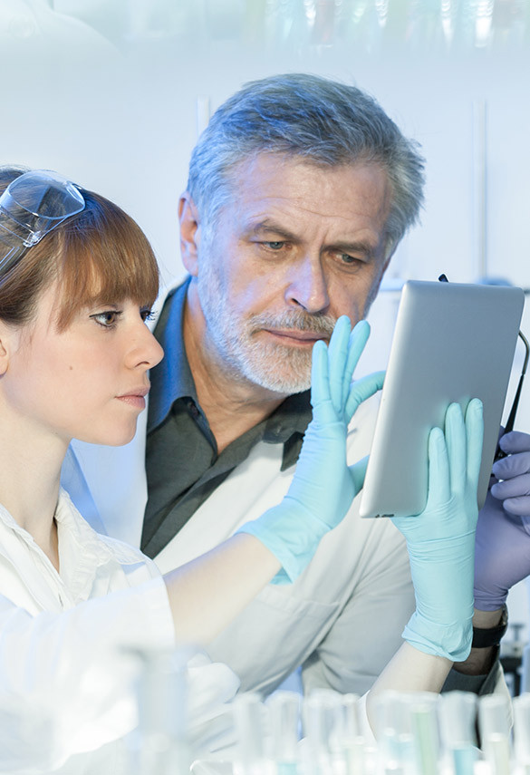 Doctors discussing over a tablet