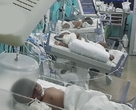 A new born baby with a nurse