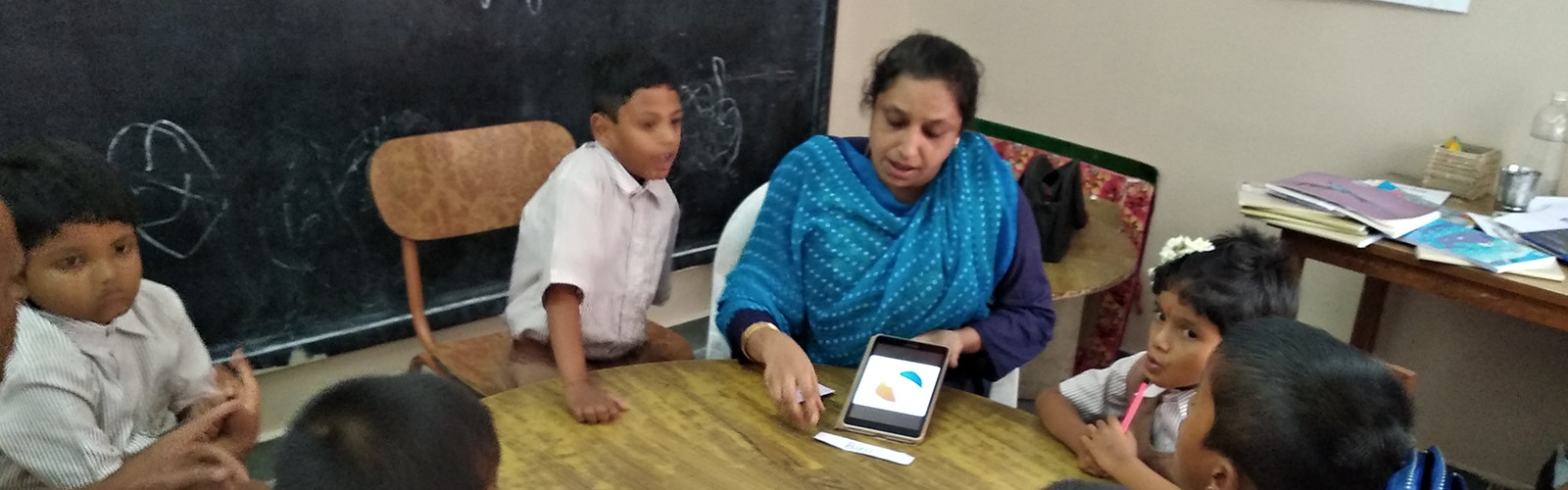 teacher is teaching to student using mobile