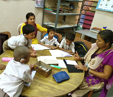 Teacher teaching children