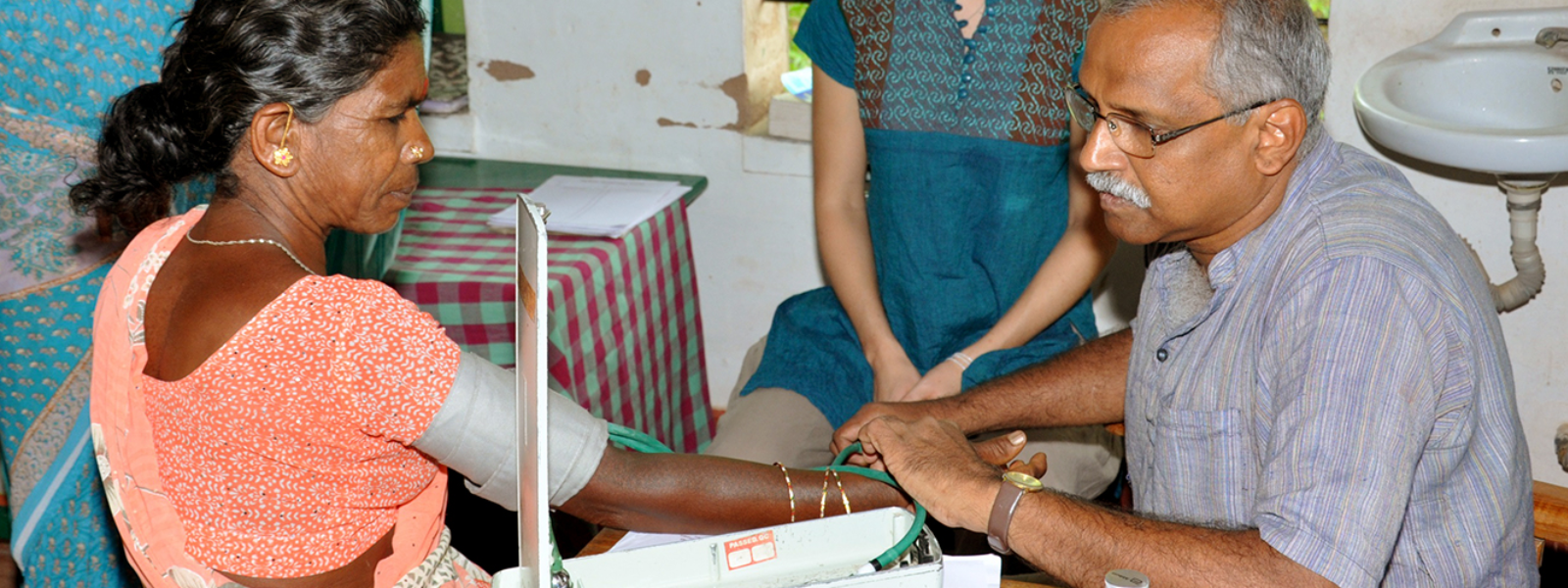 Doctor measuring a Blood Pressure for a lady patient