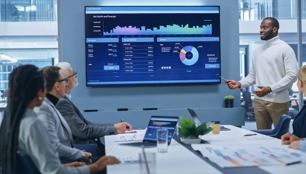 A man presenting graphical data in a meeting.