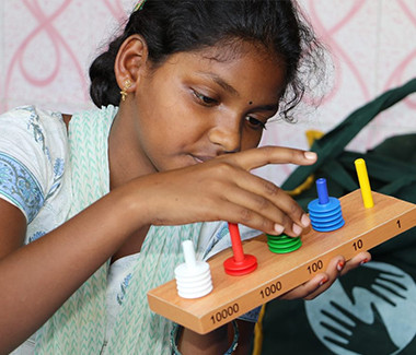 Girl working with wooden object