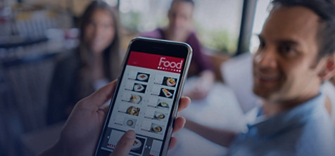 A group of people using food app
