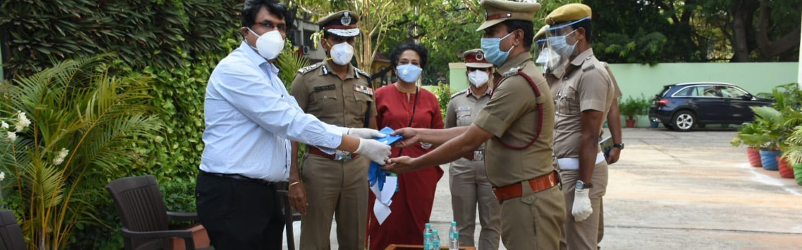 police is giving hand gloves to doctor